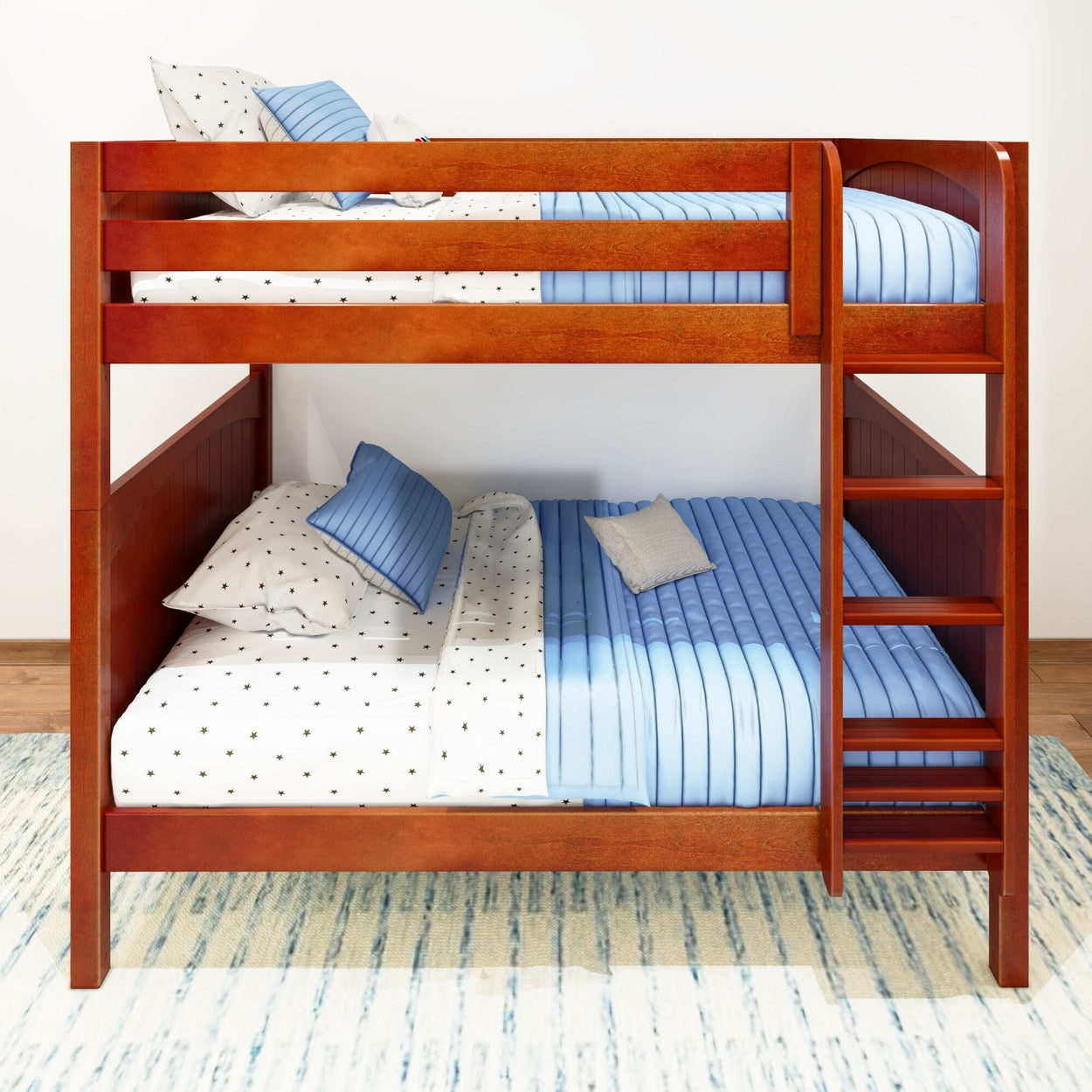 Wooden bunk bed with blue and white bedding and ladder against a white wall.