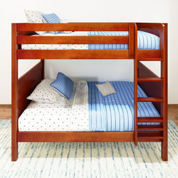 Wooden bunk bed with blue and white bedding and ladder against a white wall.