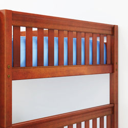 Wooden bunk bed with slatted guardrail and blue mattress.