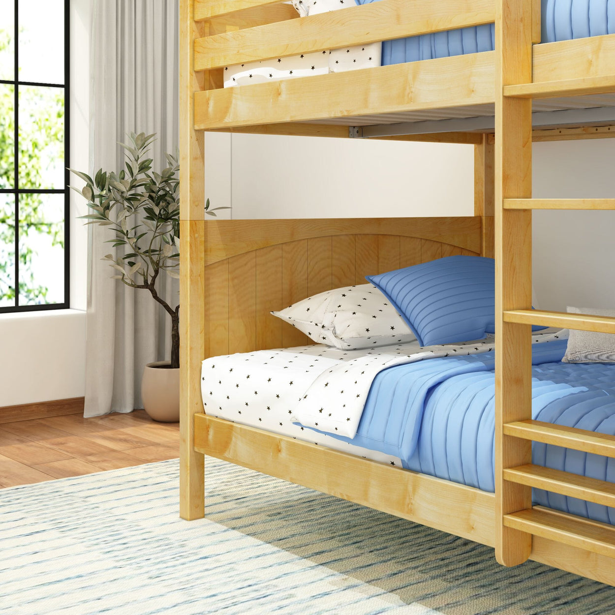 Wooden bunk bed with blue and white bedding in a well-lit bedroom with potted plant and large window.