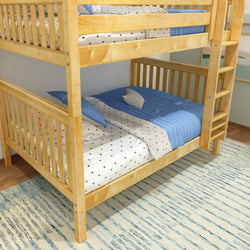 Wooden bunk bed with blue and white bedding in cozy children's room.