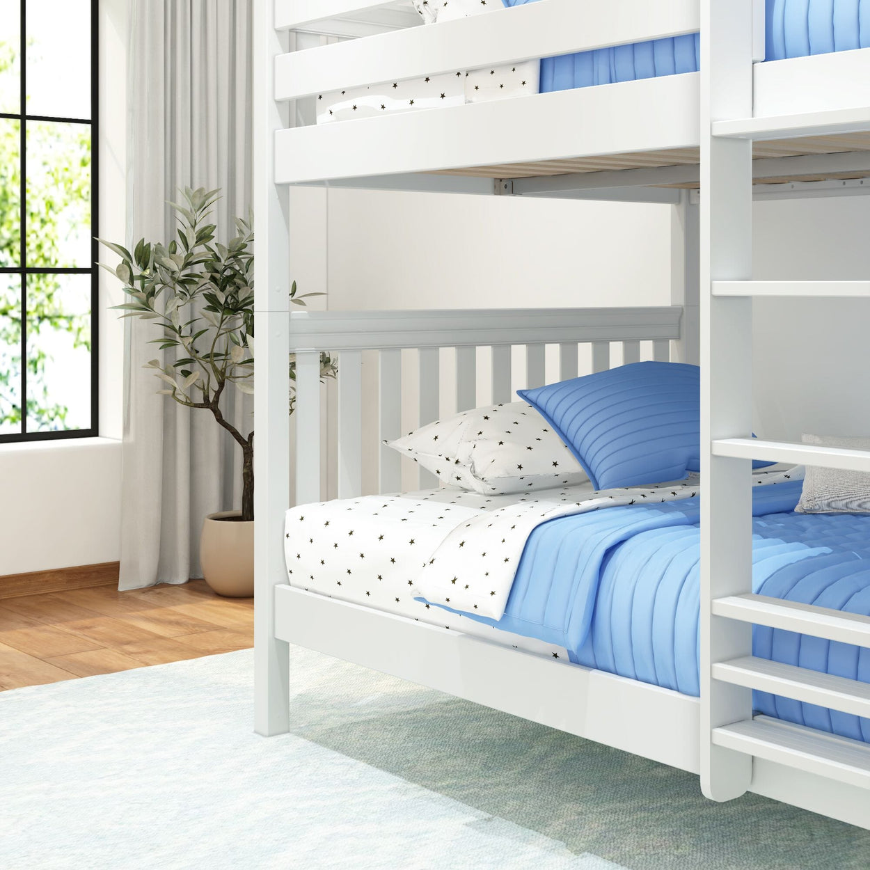 White bunk bed with blue and star-patterned bedding in modern bedroom.