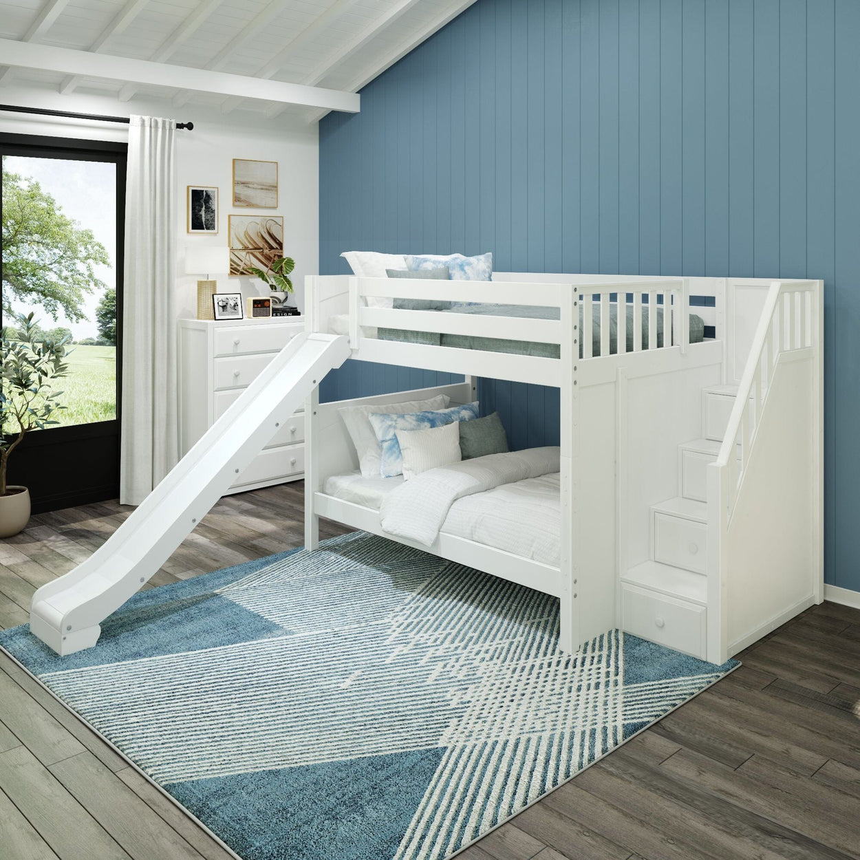 White kids' loft bed with slide and stairs in a modern blue bedroom featuring wooden flooring and a geometric area rug.