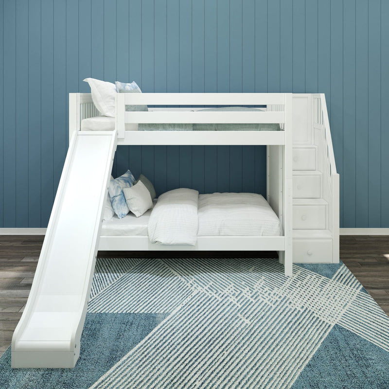 White wooden bunk bed with slide and built-in stair storage in a children's bedroom with blue paneled wall, white bedding and blue geometric rug
