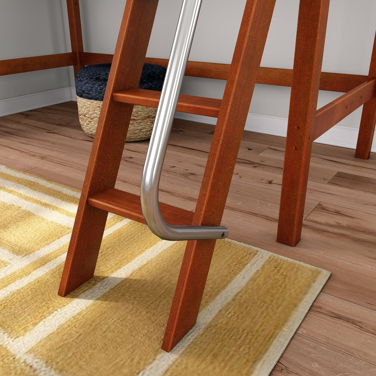 Close-up of wooden loft bed ladder with chrome metal handrail over yellow area rug on hardwood floor, modern bedroom decor