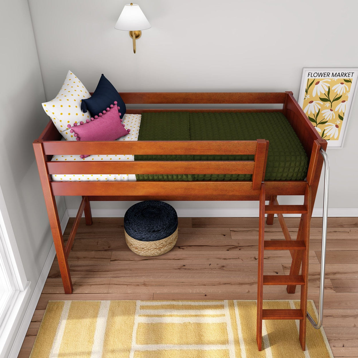 Wooden loft bed with ladder in kids bedroom, green quilt, polka-dot and pink navy pillows, wall sconce, flower poster, wicker ottoman