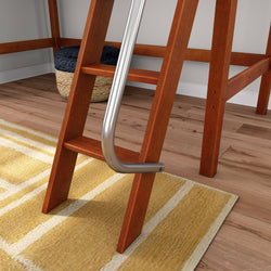 Close-up of a wooden loft bed ladder with a chrome safety rail, yellow patterned area rug and woven storage basket on a hardwood floor