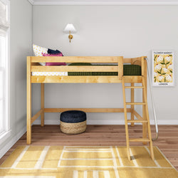 Natural wood loft bed with ladder in a modern kids' bedroom, green quilted bedding and colorful pillows, wall sconce and "Flower Market" print, woven pouf and yellow geometric rug on hardwood floor