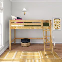 Natural wood loft bed with ladder in modern kids' bedroom, green bedding, colorful pillows, yellow geometric rug and framed wall art.