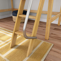 Wooden loft bed ladder with silver metal safety rail attached, set on hardwood floor beside yellow striped area rug and woven storage basket