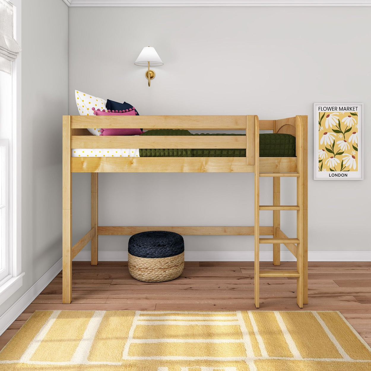 Solid pine twin loft bed with ladder in modern kids bedroom, green bedding and colorful pillows, under-bed play area with woven pouf and floral wall art