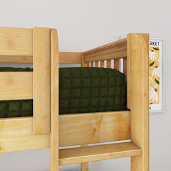 Close-up of a natural wood bunk bed ladder and guardrail with dark green quilted bedding and framed floral wall art in a modern kids' bedroom