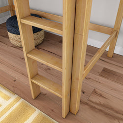 Light wooden bunk bed ladder and side rails on oak hardwood floor with woven storage pouf and yellow striped area rug
