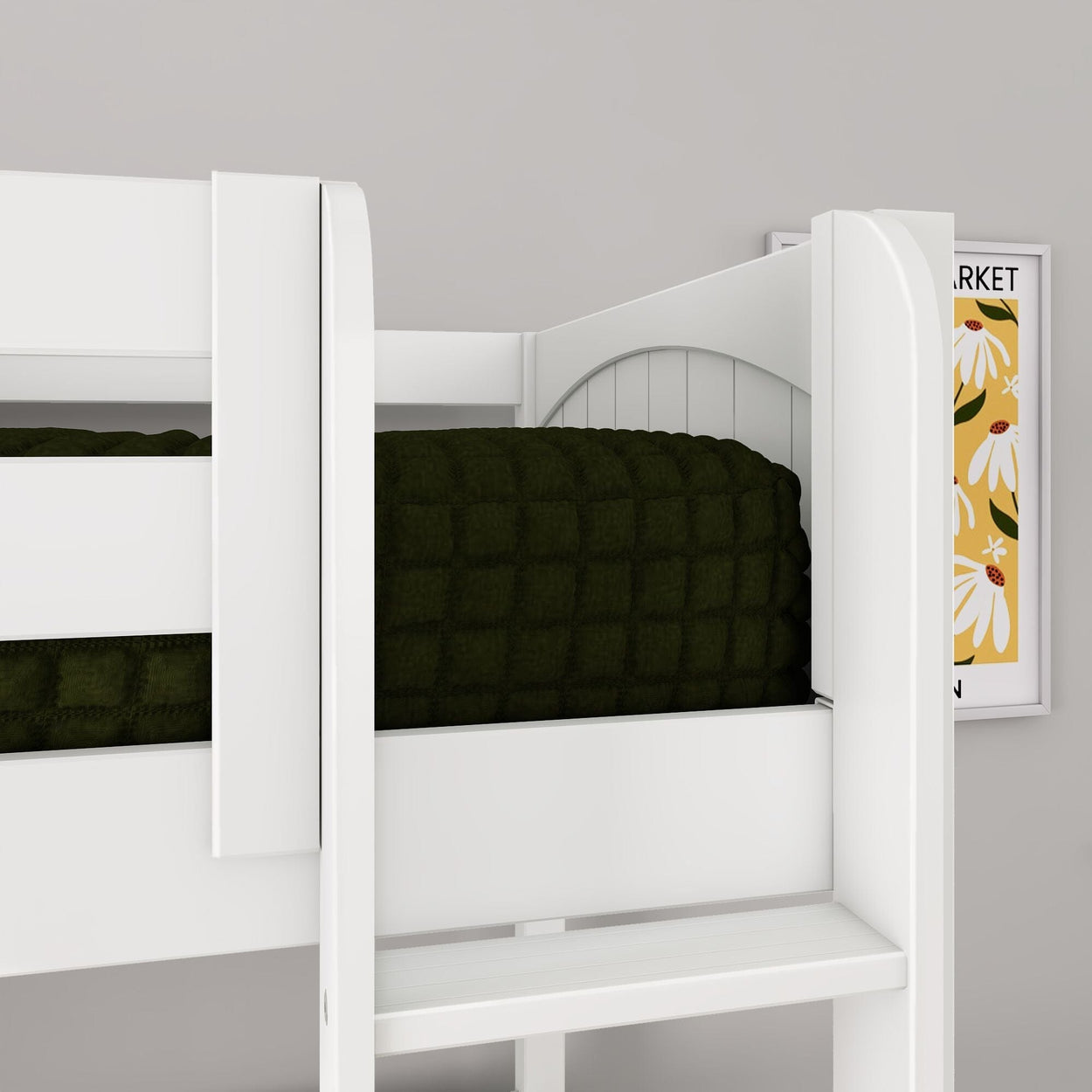 Close-up of white wooden bunk bed with dark green quilted blanket and ladder in a modern kids' bedroom featuring floral wall art