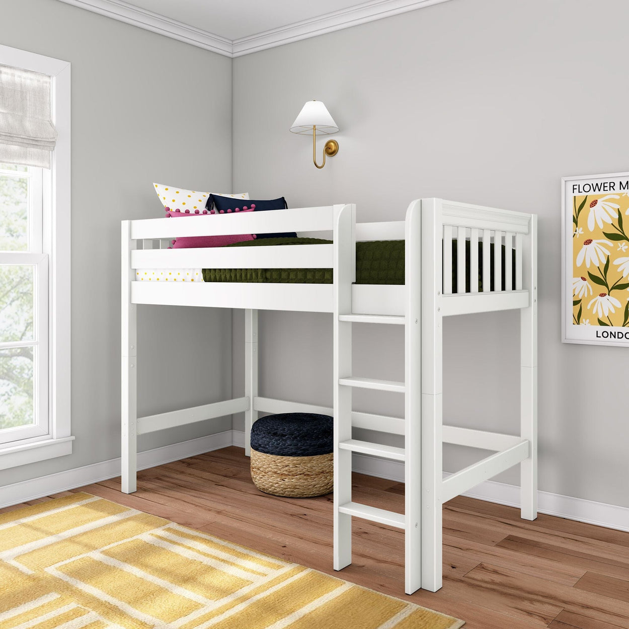 White wooden twin loft bed with ladder in a modern kids' bedroom, space-saving children's bed with green bedding and colorful accent pillows
