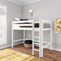 White wooden twin loft bed with ladder in a modern kids' bedroom, space-saving children's bed with green bedding and colorful accent pillows