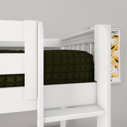 White wooden children's bunk bed with built-in ladder and guardrail, dark green quilted comforter on top bunk and yellow floral wall art