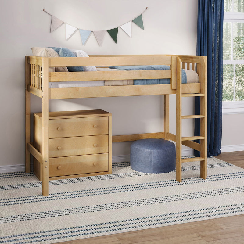 Wooden loft bed with ladder and built-in dresser, blue bedding and pouf, striped rug and fabric bunting in a modern kids' bedroom by a window