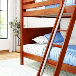 Wooden bunk bed with blue and white bedding in a bright bedroom with natural light and a potted plant.