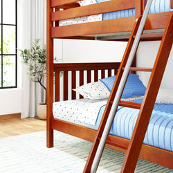 Wooden bunk bed with blue bedding in a bright, modern bedroom setting.