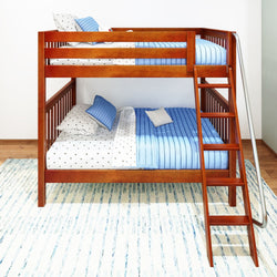 Wooden bunk bed with ladder in a bright room featuring blue and white striped bedding.