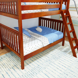 Wooden bunk bed with blue bedding in a cozy children's room.