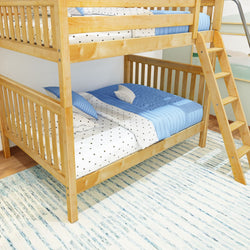 Wooden bunk bed with blue and white bedding in a cozy bedroom setting.