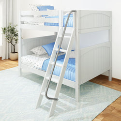 White wooden bunk bed with blue and white bedding in a bright bedroom with hardwood floors.