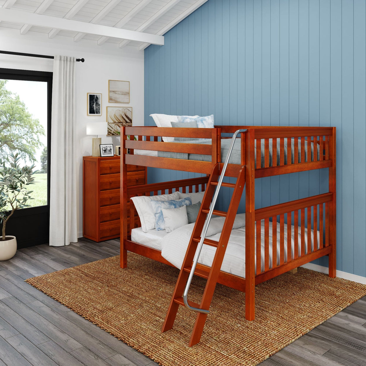 Wooden bunk bed in a stylish kids' room with blue accent wall and natural light.