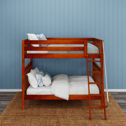 Wooden bunk bed with white bedding against blue paneled wall in a cozy bedroom setting.