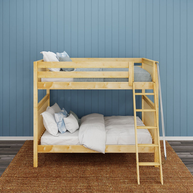 Natural light-wood twin-over-full bunk bed with ladder, gray-blue bedding and pillows against a blue paneled wall in a cozy kids' bedroom