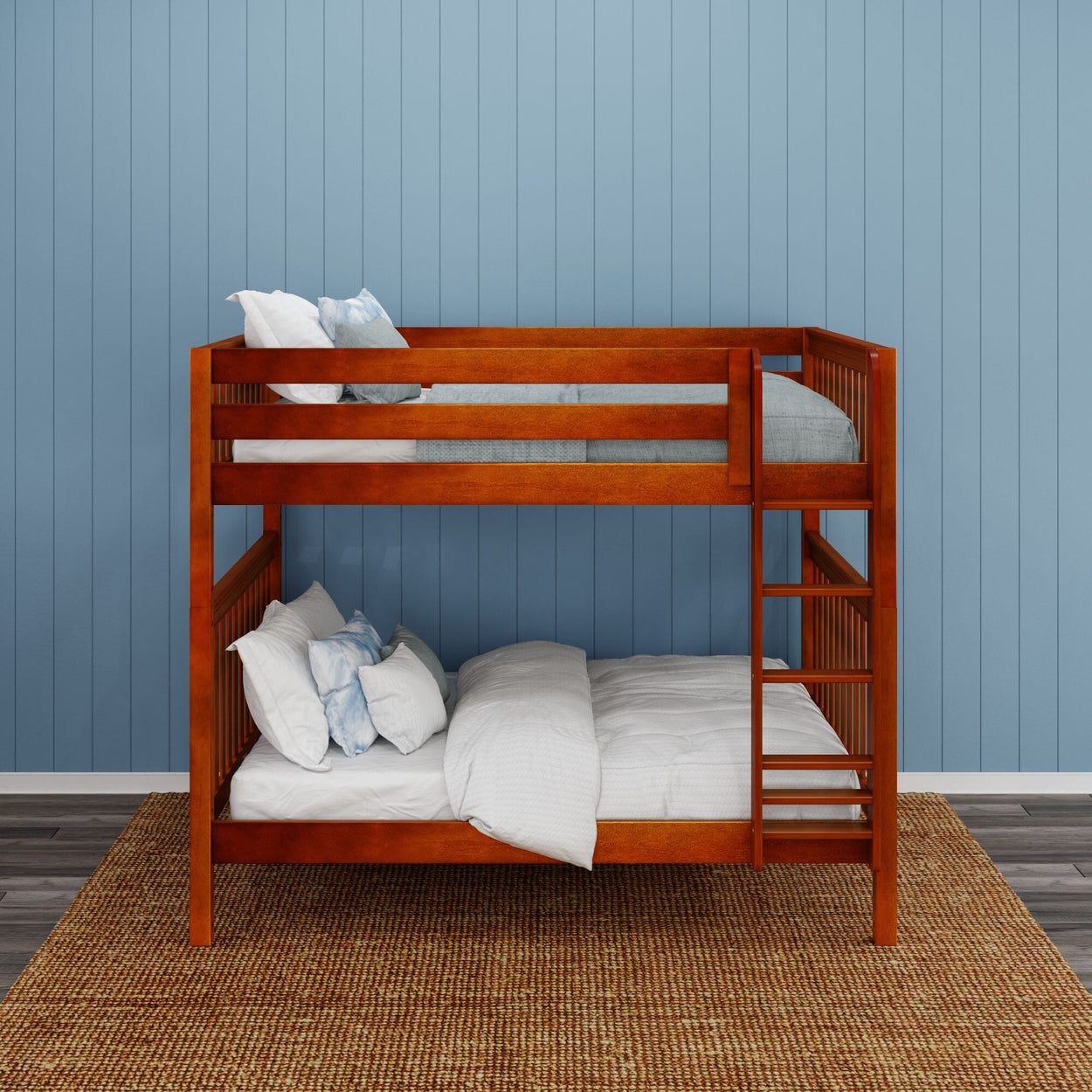 Wooden bunk bed with light blue and white bedding in a room with blue walls and hardwood flooring.