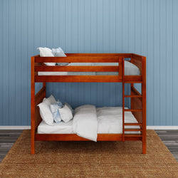 Wooden bunk bed with light blue and white bedding in a room with blue walls and hardwood flooring.