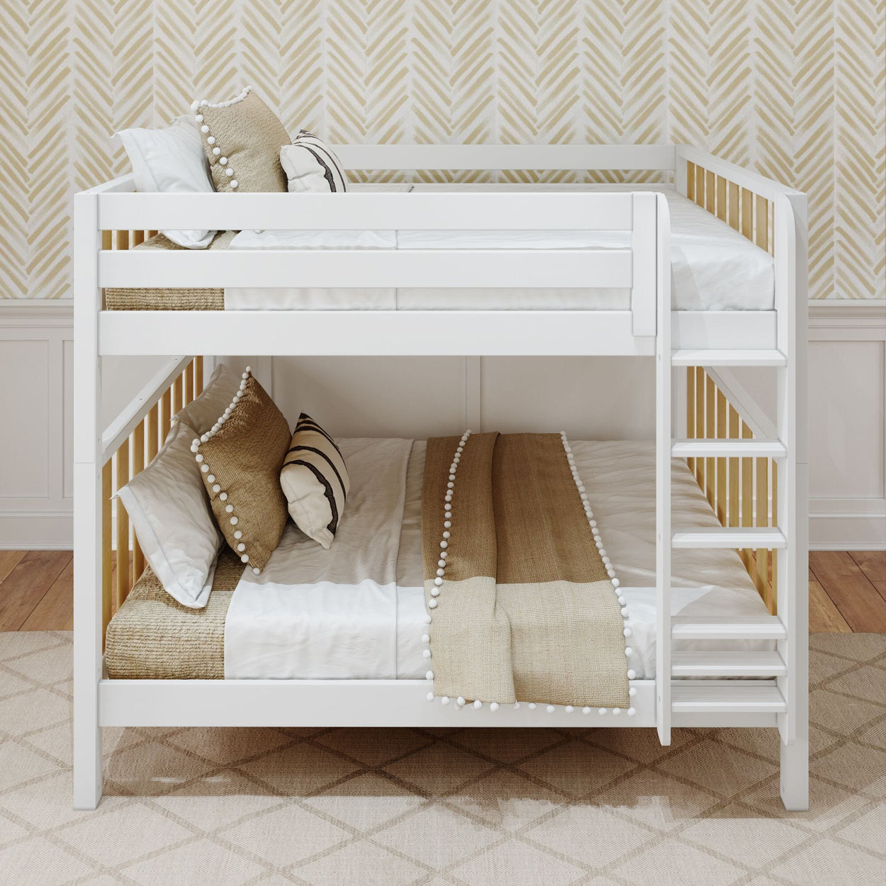 White wooden bunk bed with beige and white bedding and decorative pillows, in a stylish bedroom with chevron wallpaper.