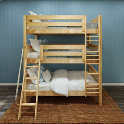 Wooden bunk bed in a modern bedroom with blue walls and woven rug.