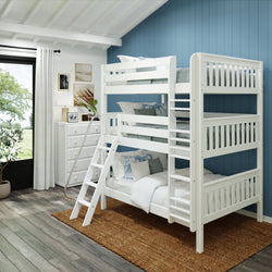 Modern white triple bunk bed in a cozy bedroom with blue accent wall and natural light filtering through large window.