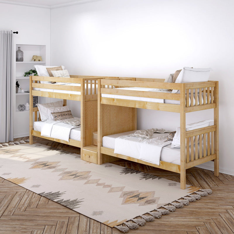Wooden twin bunk beds in a bright neutral kids' bedroom with white bedding, boho area rug and built-in shelving