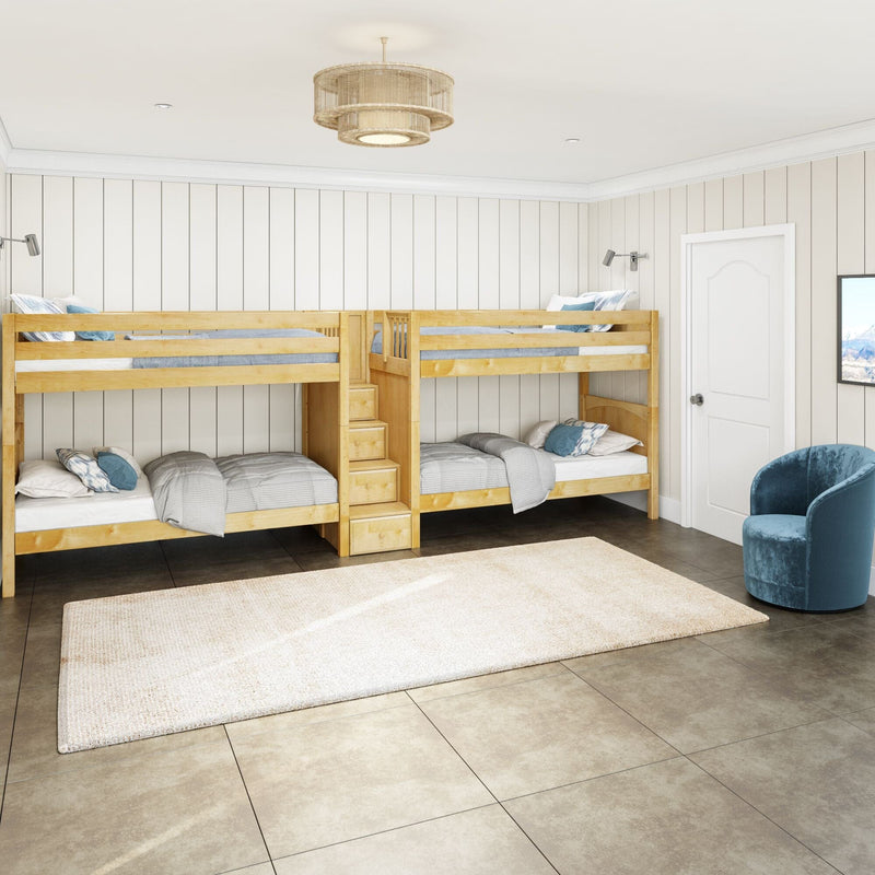 Natural wood twin bunk beds with stair storage in a bright children's bedroom featuring white shiplap walls, pendant light, tiled floor and blue accent chair