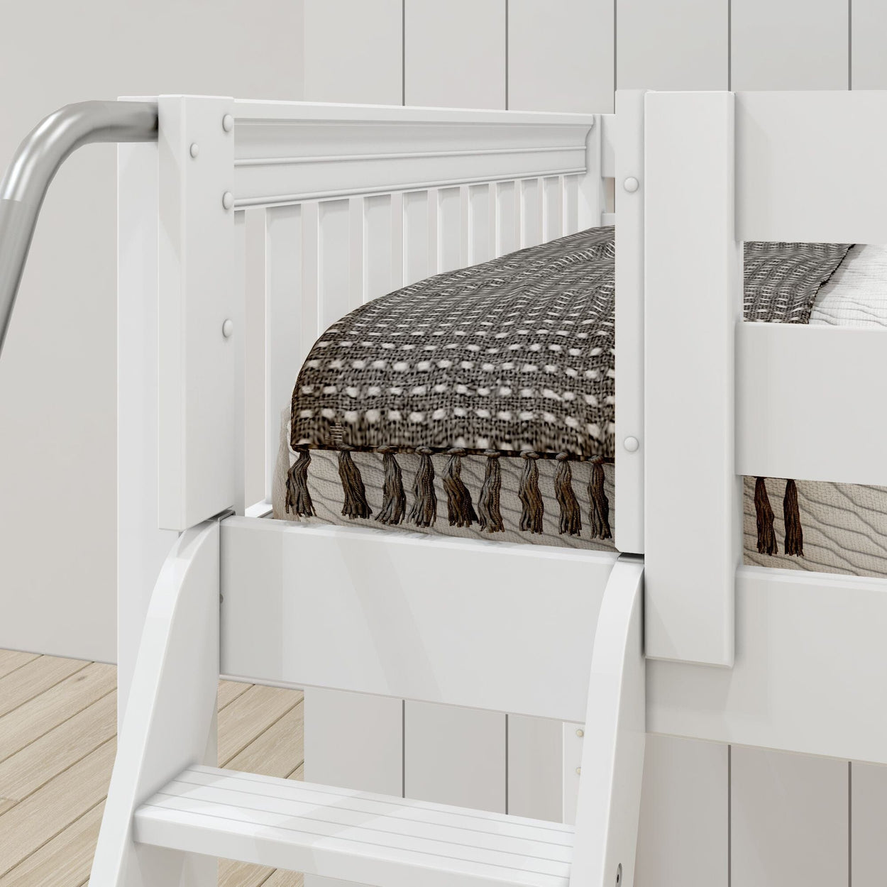 White wooden bunk bed with decorative gray blanket and sturdy ladder in a modern bedroom setting.