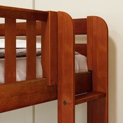 Sturdy wooden bunk bed frame with mattress in a cozy bedroom setting.