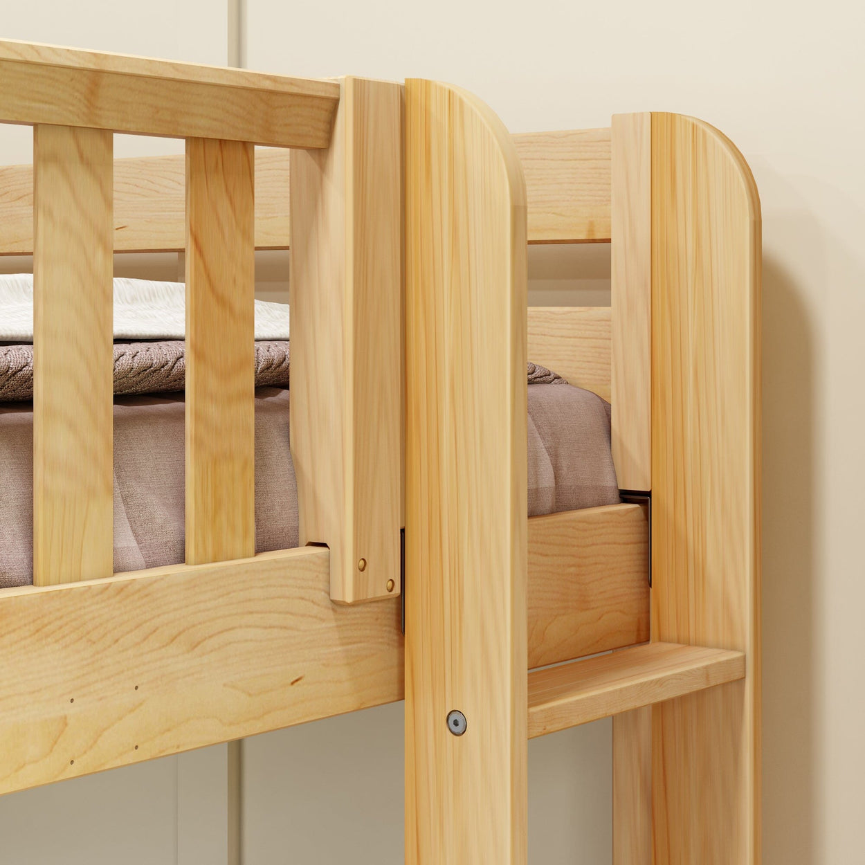 Wooden bunk bed close-up showcasing sturdy construction and natural finish.