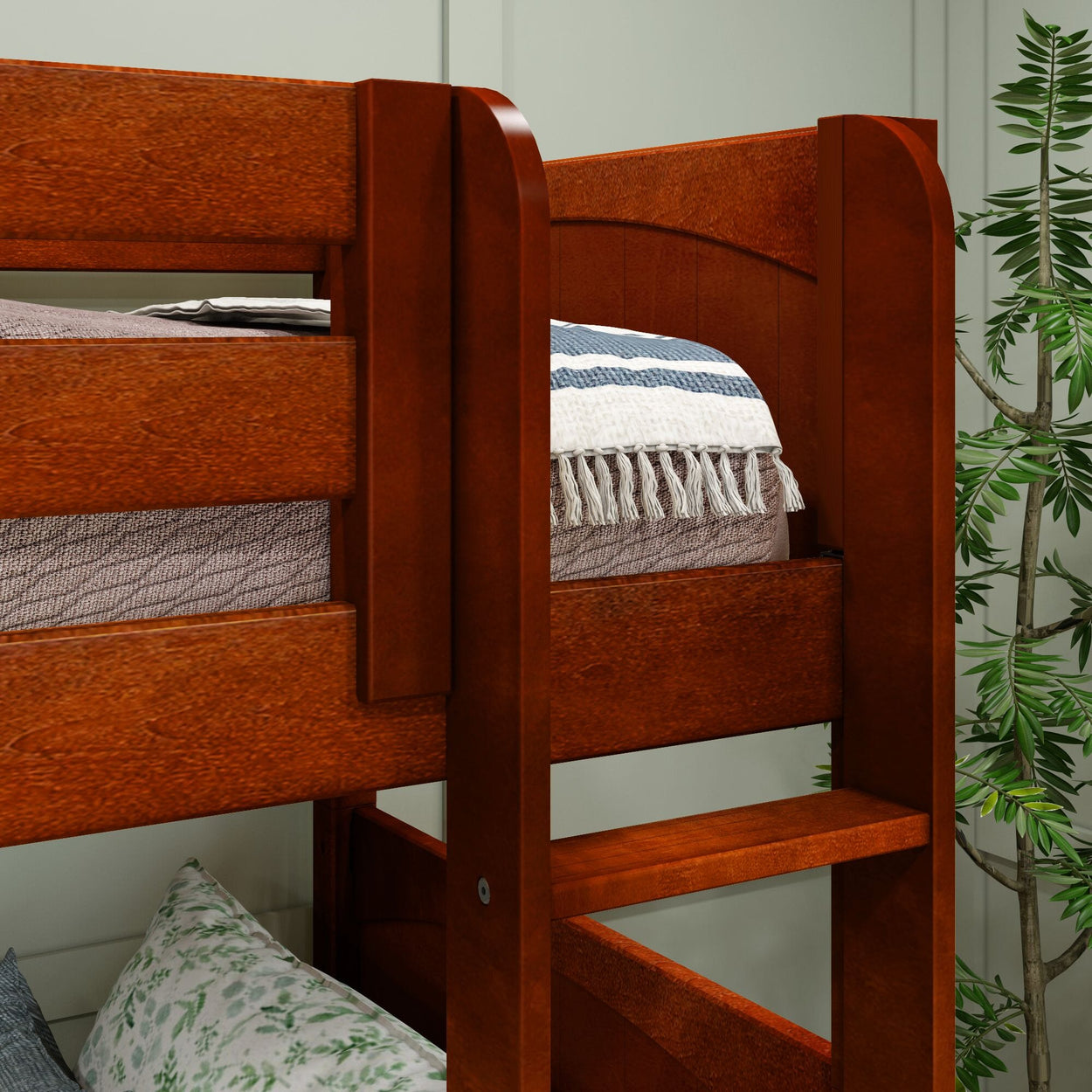 Wooden bunk bed with cozy blankets and pillows in a modern bedroom setting.