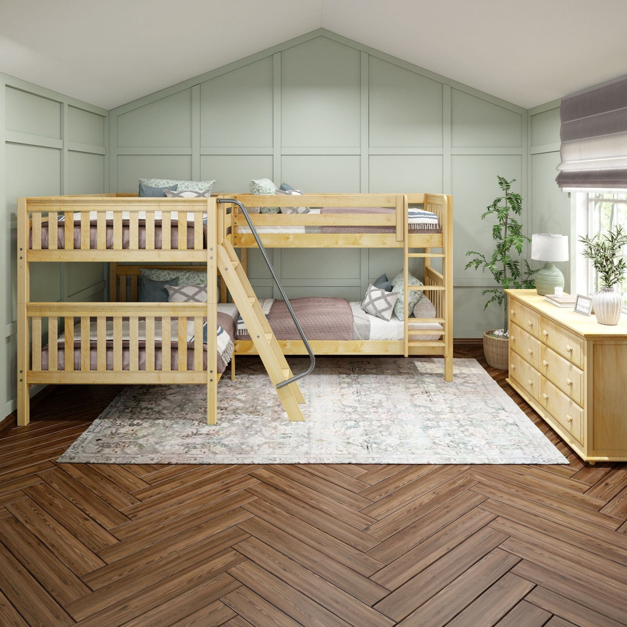 Quad bunk beds in cozy bedroom with light green walls and wooden furniture.