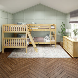 Quad bunk beds in cozy bedroom with light green walls and wooden furniture.
