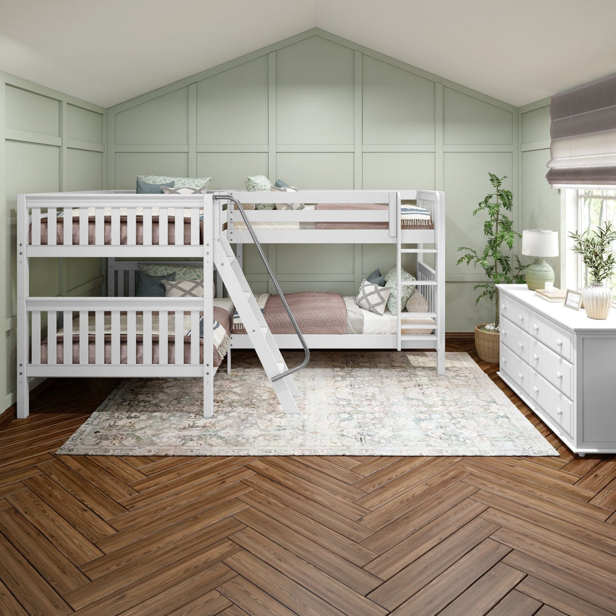 White triple bunk bed in a modern kids' room with hardwood flooring and green walls.