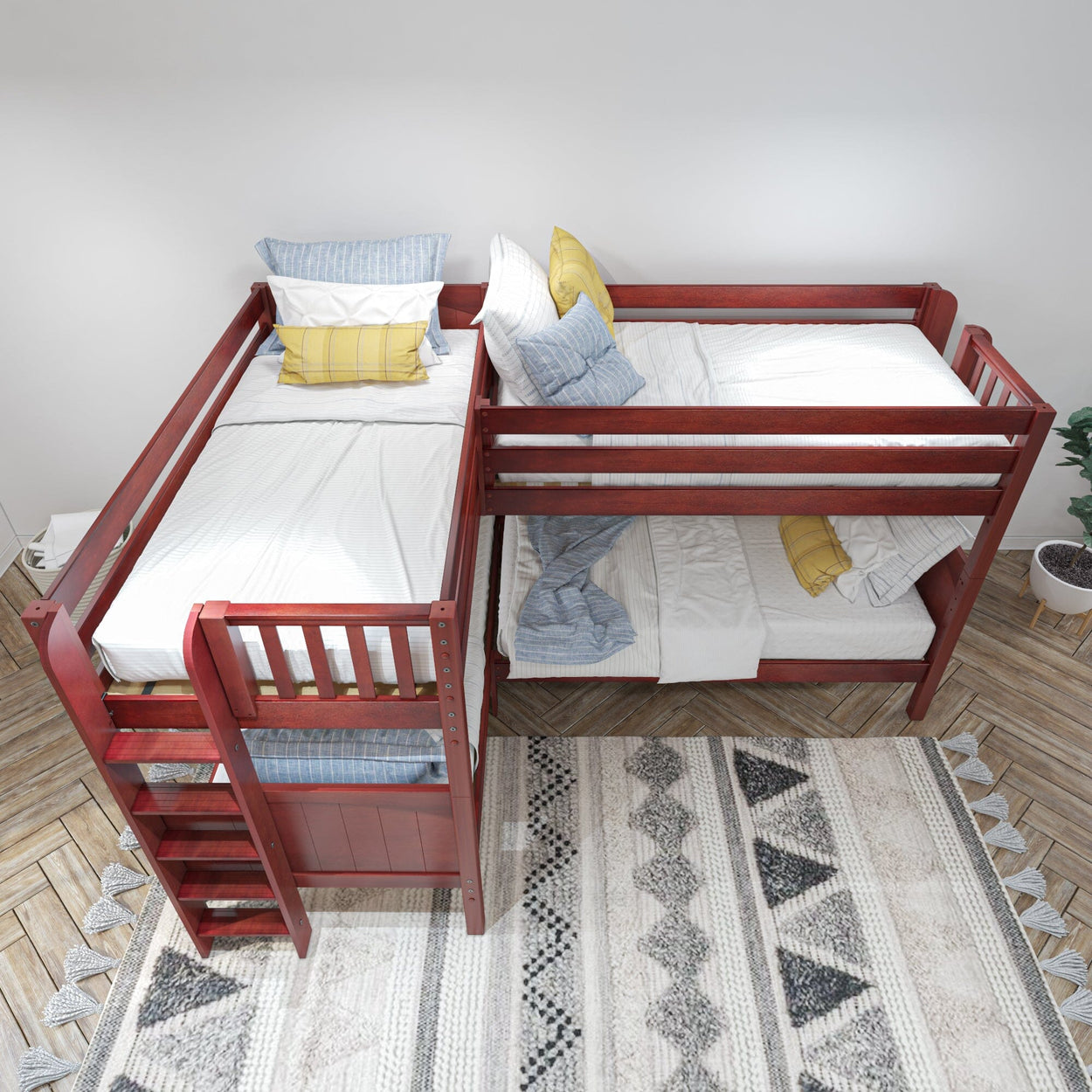L-shaped wooden bunk bed with red finish featuring white and blue bedding in modern bedroom.