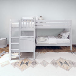 White wooden bunk bed in modern kids bedroom with cozy bedding and geometric rug.