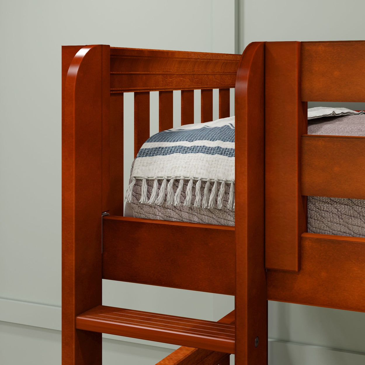 Wooden bunk bed frame with striped bedding and cozy blanket.