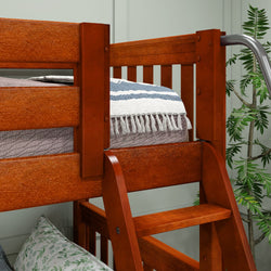 Wooden bunk bed with cozy bedding and decorative plants in a modern bedroom setting.