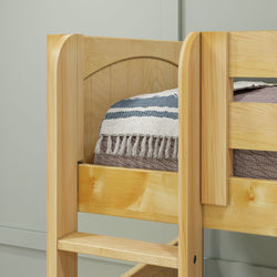Wooden bunk bed with ladder and cozy striped blanket.